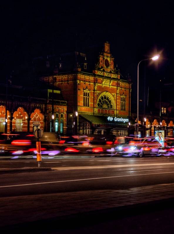 Light trails photographed with an iPhone. In the background the railway station Groningen.